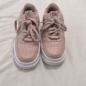 Pinkish beige Air Force ones With a chunky bottom